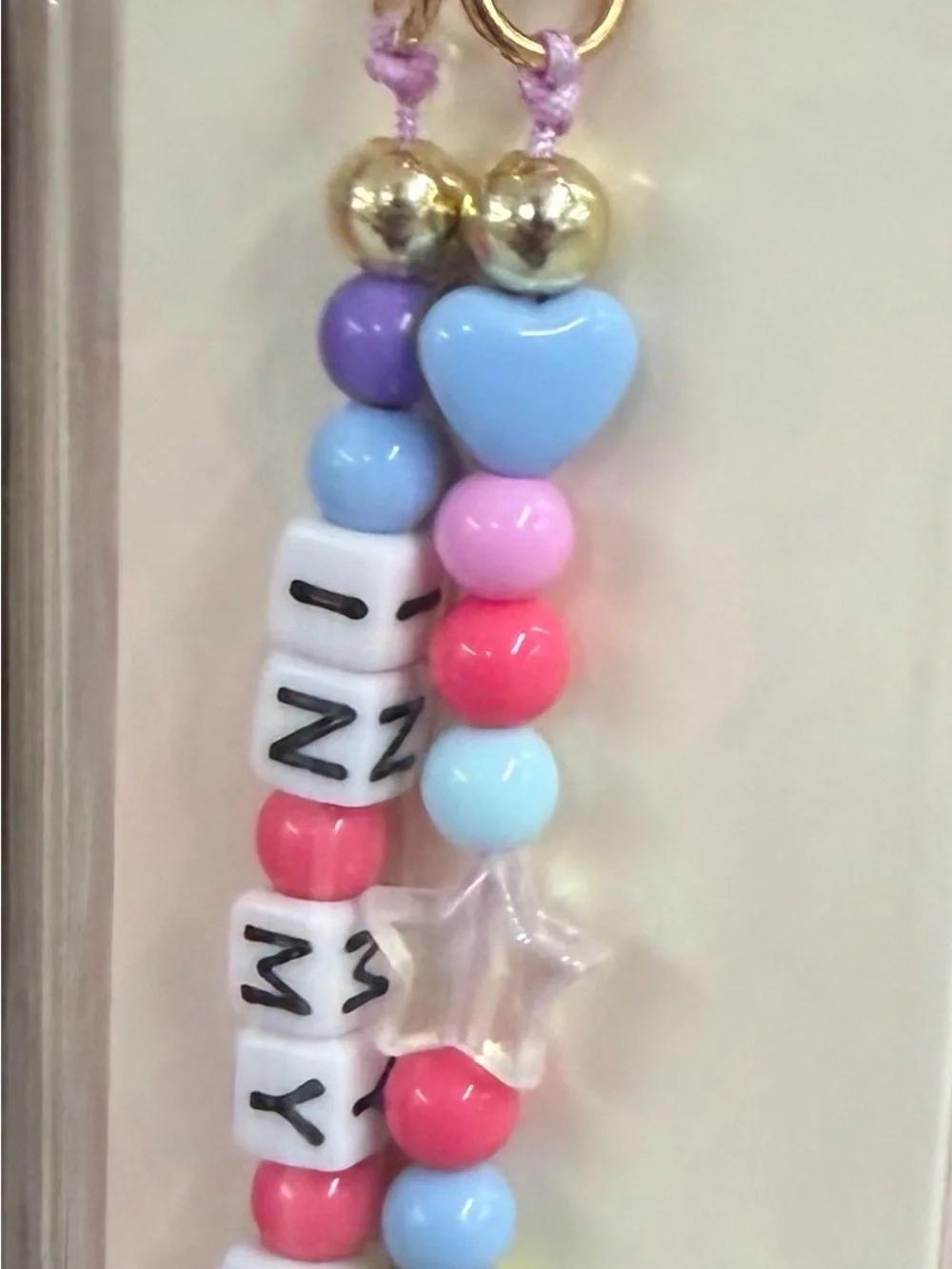 Charm and cellphone wristlet lot 100 packs new sealed packs